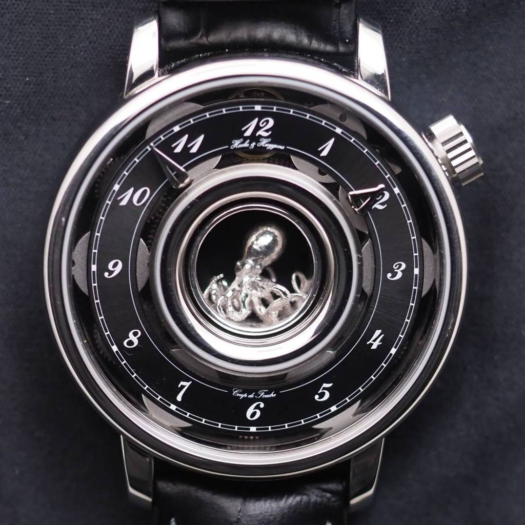 A photograph of the Hooke and Huygens watch with an octopus sculpture.